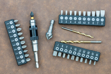 Magnetic drill bit holder with various interchangeable bits, drill bits and countersink. Close up...