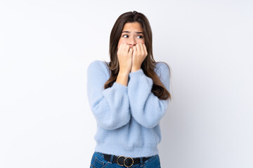 Young teenager Brazilian girl over white background