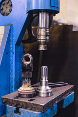 Metal and steel processing on old equipment in the garage.