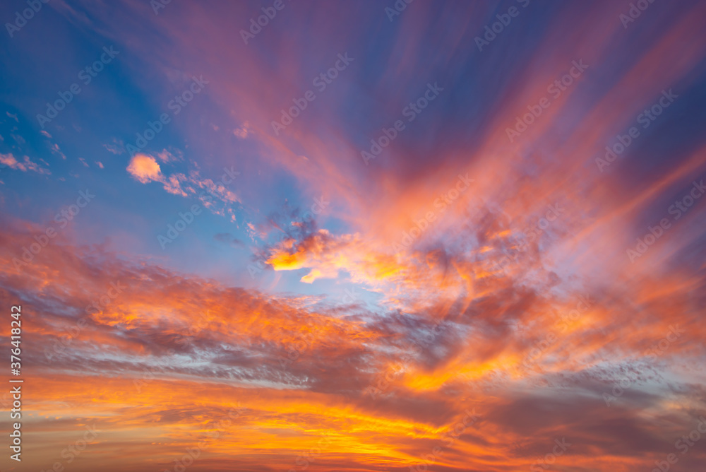 Wall mural dramatic orange sky with clouds, sunset background