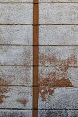 An old stone plastered cement wall as a background for any design. Texture of a plastered stone wall.  background for the collage