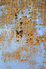 Corroded white metal background. Rusted white painted metal wall. Rusty metal background with streaks of rust. Rust stains. The metal surface rusted spots. Rysty corrosion.