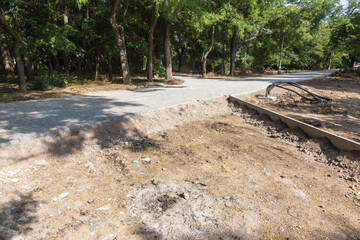 building a new path in a summer park. Marking, repair and reconstruction of the pedestrian walkway in the city park