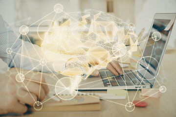 Man typing on keyboard background with brain hologram. Concept of big Data. Double exposure.