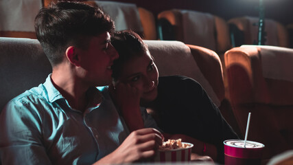 People audience watching movie in the movie theater cinema. Group recreation activity and...