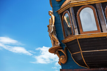 Figurehead (nose shape) is an ornament on nose of sailing vessel, rostrum or caryatid. Wooden sculpture of goddess of victory, Nick, brought happiness and luck to ancient wood sailboat Statue of luck - obrazy, fototapety, plakaty