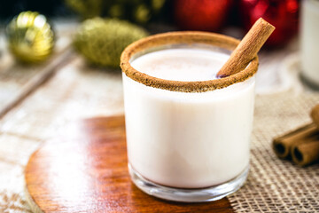 Warm, traditional Christmas eggnog with grated nutmeg and cinnamon.
