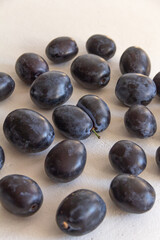 fresh dark blue plum on white background
