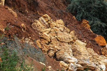 Landslide zone on Black Sea coast. Rock of sea rock shell. Zone of natural disasters during rainy season. Large masses of earth slip along slope of hill, destroy houses. Landslide - threat to life