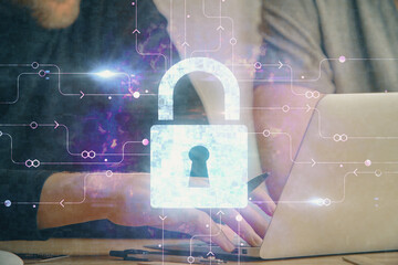 Multi exposure of lock icon with man working on computer on background. Concept of network protection.