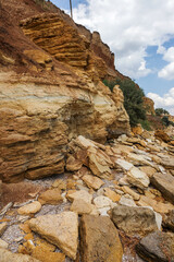Landslide zone on Black Sea coast. Rock of sea rock shell. Zone of natural disasters during rainy season. Large masses of earth slip along slope of hill, destroy houses. Landslide - threat to life