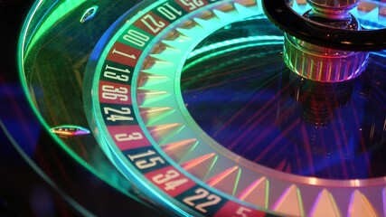 French style roulette table for money playing in Las Vegas, USA. Spinning wheel with black and red sectors for risk game of chance. Hazard amusement with random algorithm, gambling and betting symbol