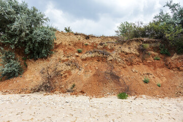 Landslide zone on Black Sea coast. Rock of sea rock shell. Zone of natural disasters during rainy...