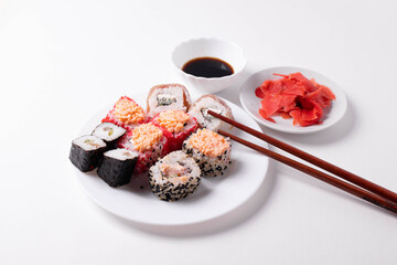 asian rice rolls on the white plate. white background.