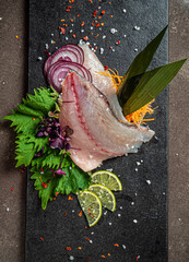 Delicious fresh fish on dark  background