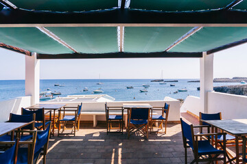 View from a terrace of a bar overlooking the sea on a sunny summer day