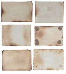 Bunch of Old vintage texture retro paper with burned edges, stains and scratches background