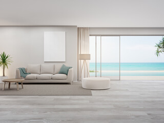 Blank picture frame near beige sofa on empty wooden floor of large living room in modern house or luxury pool villa. Cozy home interior 3d rendering with beach and sea view.