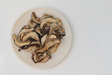 dried porcini mushrooms on white background
