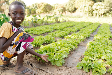 Agriculture for African children, little black boy posing for the camera