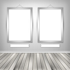 Gallery interior with two empty frames on wall
