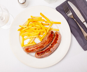 Eastern european cuisine - sausages with potatoes and onion
