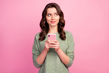 Portrait of thoughtful inspired girl use smart phone want write blog post decide what subject...