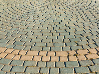 Fototapeta premium Sidewalk tile. Close-up paving slabs by mosaic. Road paving, construction. Colored concrete paving slab. Diagonal.