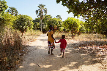 Fototapeta premium Candid picture of African children enjoying their life outdoors in an African village near Bamako, Mali.