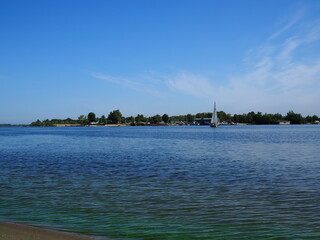 sailing yacht floating on the river in summer.