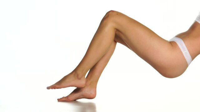 nicely groomed female legs on a white background 