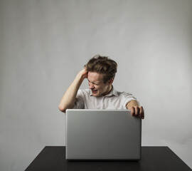 Frustrated young man in white.