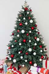 Christmas tree with gift decor for the new year winter in the white holiday card room