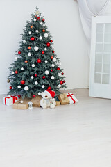 Christmas tree with gift decor for the new year winter in the white holiday card room