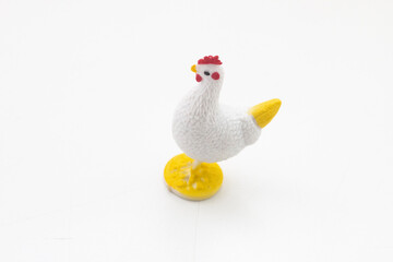 Toy chicken on white background