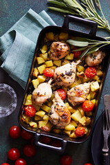 Chicken drumsticks with vegetables and potatoes