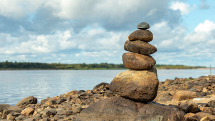river stones stacked on top of each other on the river Bank