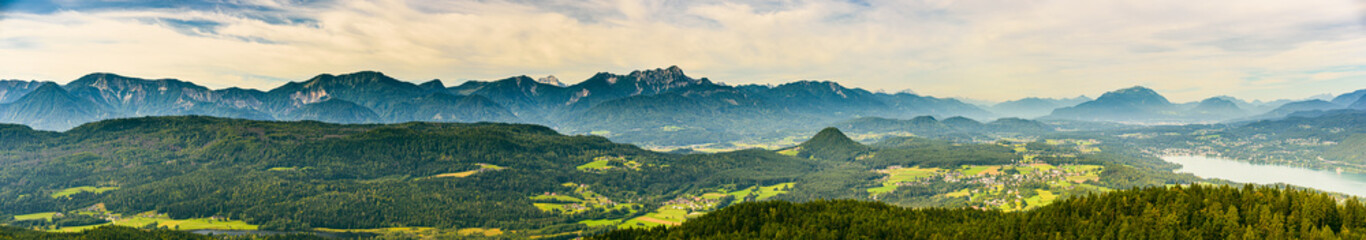 Panorama of Alpine mountains near Lake Worthersee and Velden city