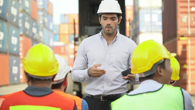 foreman training worker in morning meeting  before entering start working in industrial container cargo outdoors