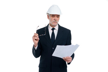 Older business man, civil engineer wear a white safety helmet with project paper isolated on white background