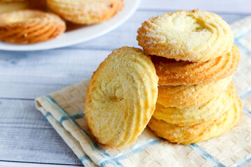 Tasty sugar cookies on wooden table