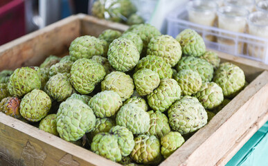 Sugar apple on wooden box in the fruit market Asian - Annona sweetsop or or custard apple