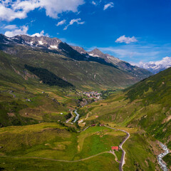 Fototapeta na wymiar Aerial view of the Realp village and the Reuss river in Switzerland