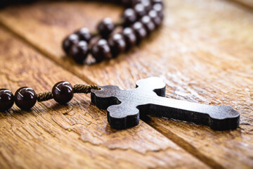 Obraz na płótnie Canvas wooden crucifix, or rustic wooden rosary. Catholic or Christian symbol of faith