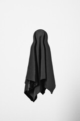 Flying Halloween Ghost. Scary black ghost on white background. Vertical orientation