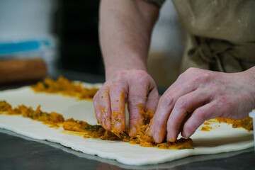 Baker preparing vegetable pastries