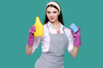 Housewife wearing apron holding cleaning agent and sponge, caucasian woman and cleaning product supply