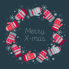 Decorative wreath with quote Merry Christmas on dark background. Traditional winter holidays home and door decoration. Mittens, Xmas night, snowflakes.