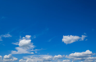 Naklejka na ściany i meble White cumulus clouds in blue sky background