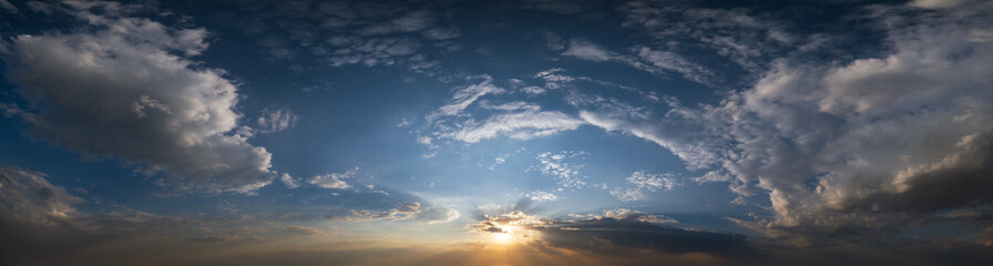 Summer sunset sky panorama with fleece colorful clouds. Evening dusk good weather natural background.